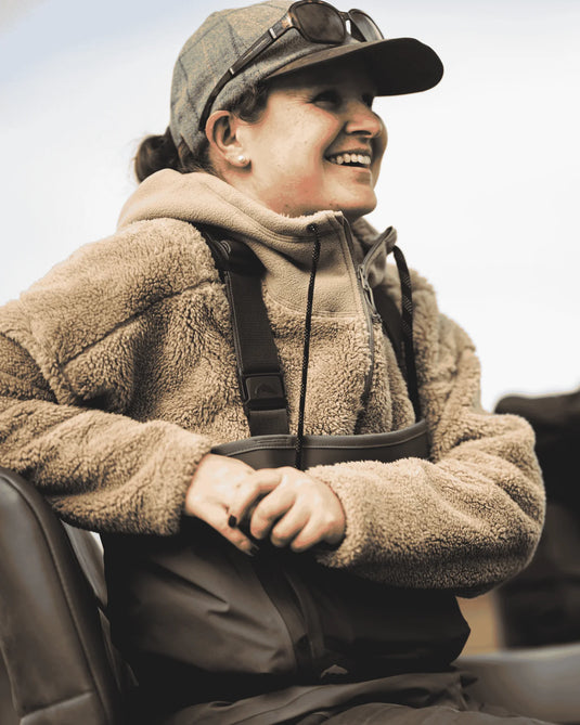 Fleece hoodie worn on model with hood, drawstrings, and front pocket