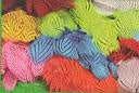 Silver pheasant feather print fabric in orange, blue, and chartreuse