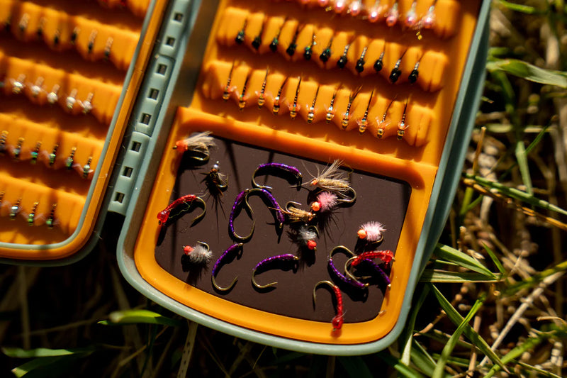 Load image into Gallery viewer, MagPad tackle box insert open with mixed fly lures in orange sections
