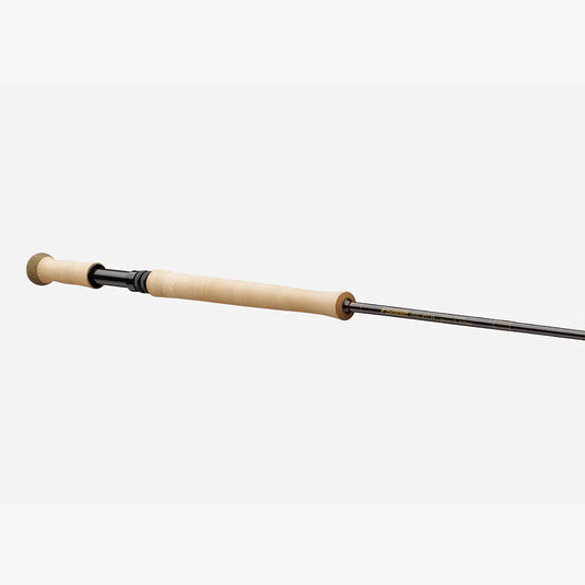 Spey fishing rod with light cork handle and black reel seat, angled view.