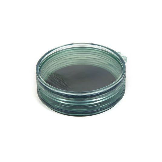 Shallow fly puck container with clear green rim and dark base