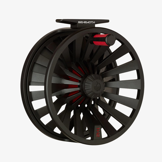 Black fly reel with red interior accents and perforated spoke design