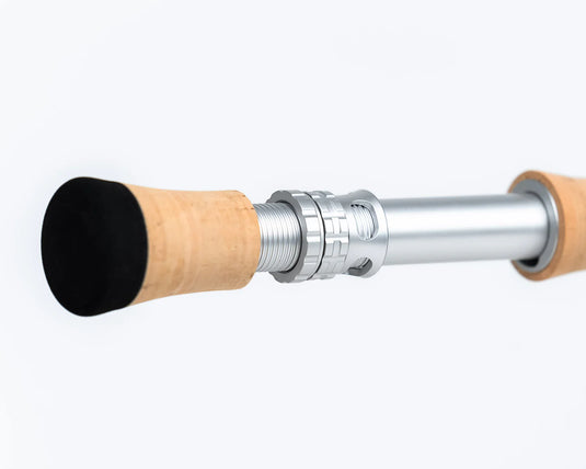 Fishing rod butt end with black cap, cork handle, and metal reel seat