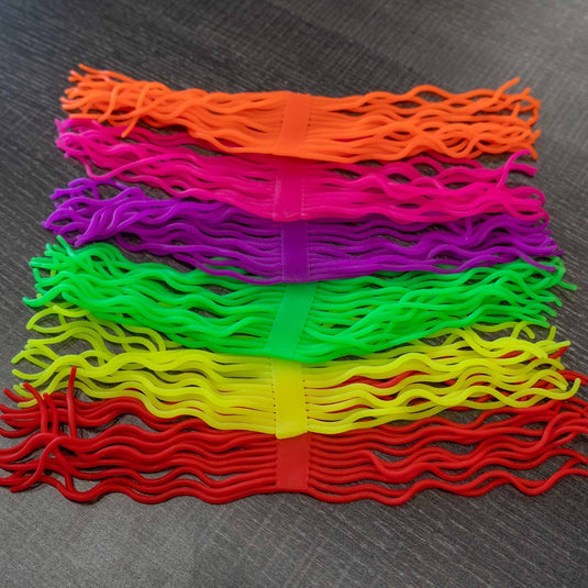 Colorful squirmy worm material, layered fringe strips in orange, pink, purple, green, yellow, red