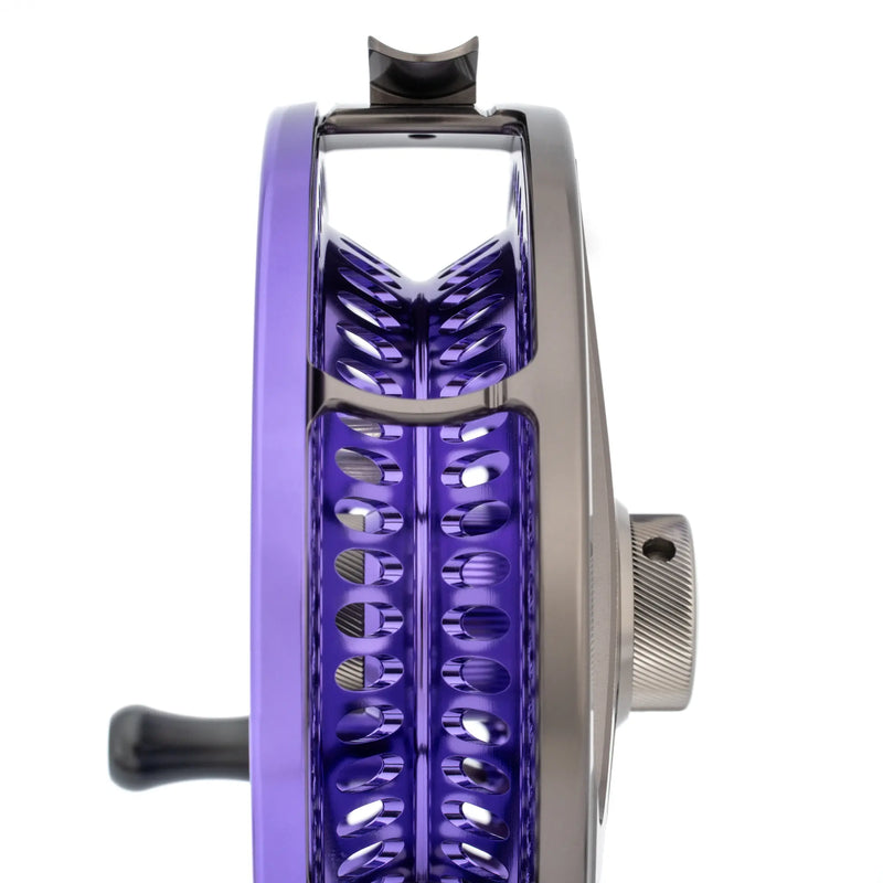 Load image into Gallery viewer, Fishing reel with chrome body and purple spool, plus textured silver side knob
