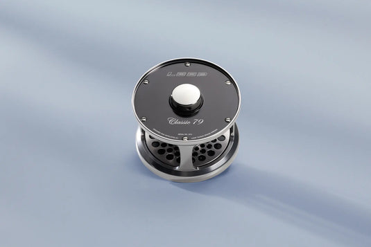 Loop Classic Series reel with dark face, engraved badge, and center knob