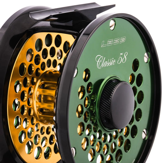 Green fishing reel with perforated spool and textured dark drag knob