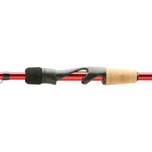 Shimano Sojourn fishing rod with cork handle and black reel seat, red shaft