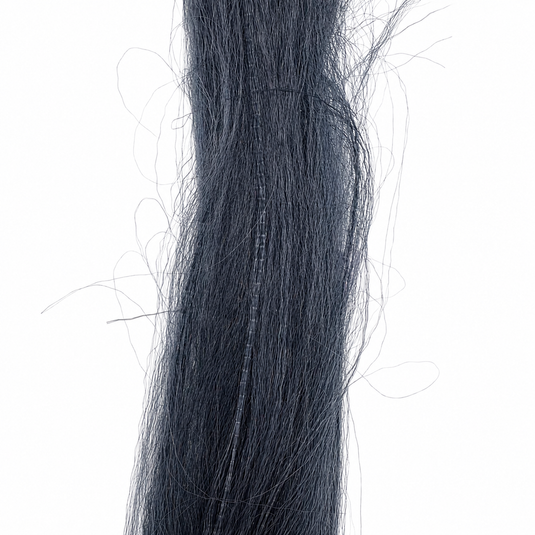 Dark navy fly-fishing hair strands, close-up view