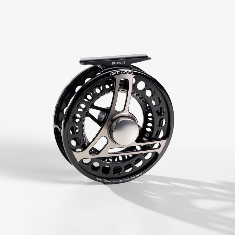 Load image into Gallery viewer, Fishing reel spool, black and silver with perforated rim and central star
