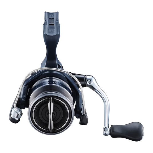 Spinning fishing reel close-up, dark blue cap with silver spool and side handle