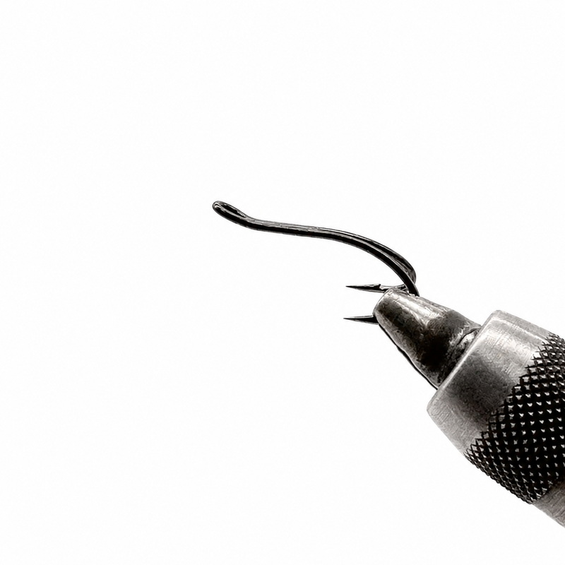 Load image into Gallery viewer, Barbed fishing hook on metal tool with curved shank
