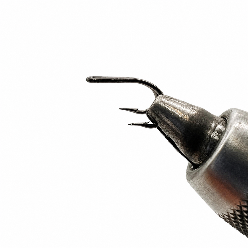 Load image into Gallery viewer, LOOP double tube fly hook close-up held by tool, curved eye and barbs
