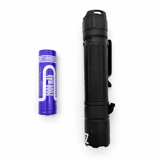 Black UV flashlight with clip and included battery cell