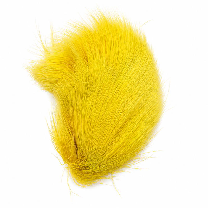 Load image into Gallery viewer, Bright yellow deer body hair tuft with compact teardrop shape
