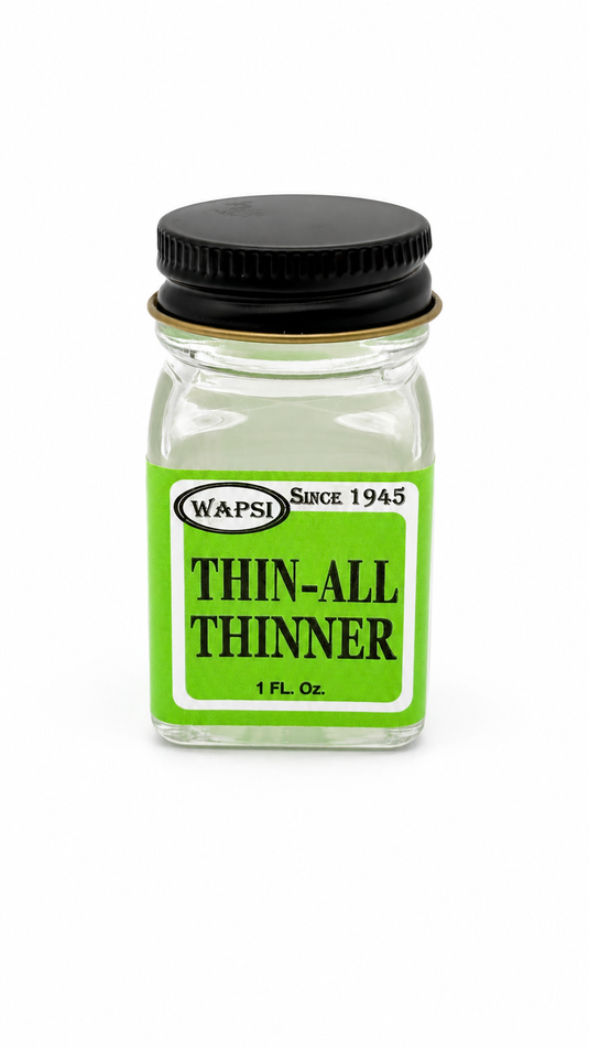 WAPSI thinner bottle with black cap, green label, clear glass.