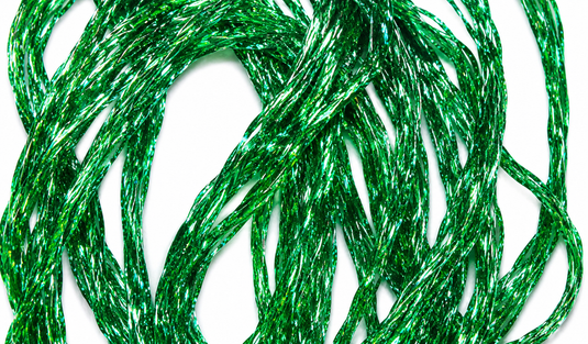 Green holographic diamond braid cords close-up, shiny braided threads in a coil
