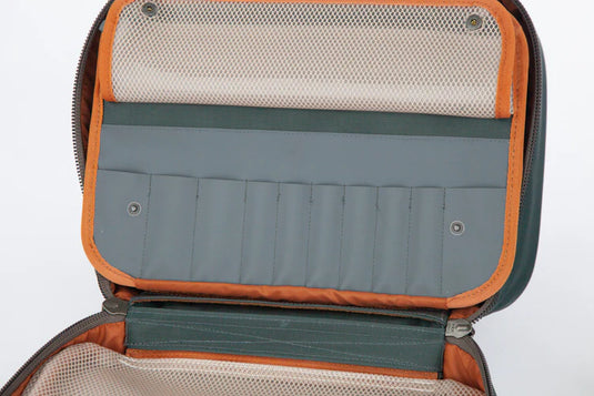 Open orange-trim fly tying kit bag showing mesh lid and multiple elastic slots