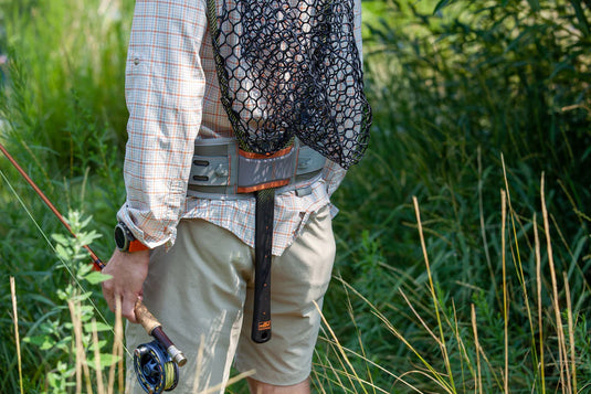 Wading belt worn with waders: gray belt with orange center panel and buckle