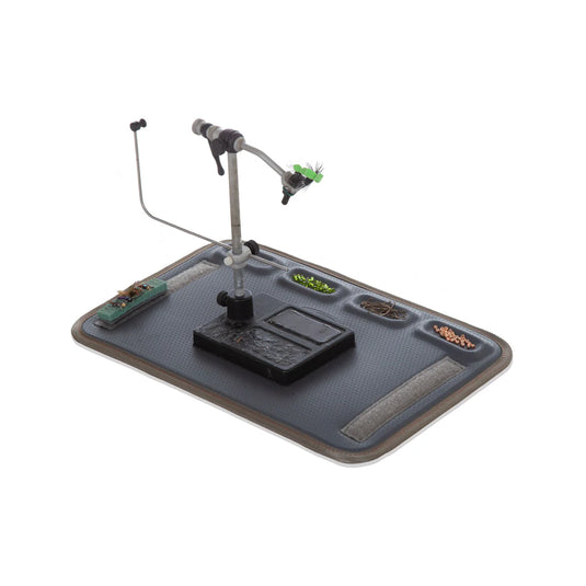 Fly tying kit clamp vise on blue-gray tying mat with attached tools